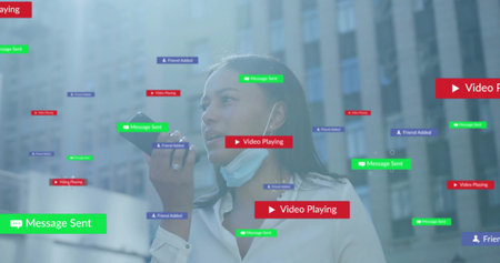 Speaking woman in white blouse holding phone to mouth in business district, mask, earbud, UI labels....