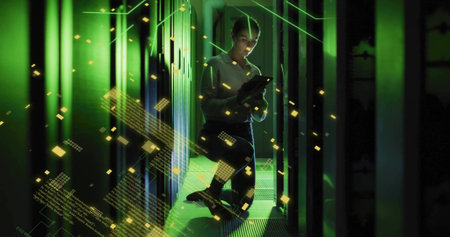 Kneeling IT technician in shirt and trousers checking tablet among server racks, gold particles....