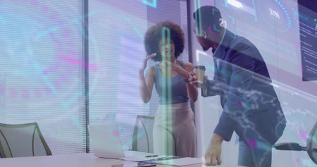 Presenting woman in sleeveless gesturing, man in blazer holding coffee-cup at office, laptop AR....