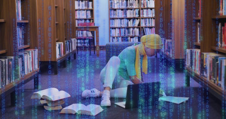 Typing woman with yellow headscarf studying on library floor, with laptop, open books, code overlay....