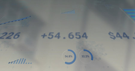Displaying analytics dashboard on pale translucent surface showing +54.654 $44 56.8% and 32.2%....