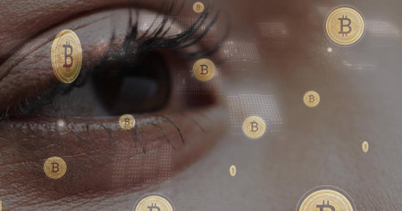 Focusing close-up woman's eye with eyelashes and skin pores at studio, showing gold bitcoin icons....