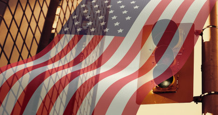 Displaying signal on metal pole at corner with US flag overlay and chainlink shadows, copy space....