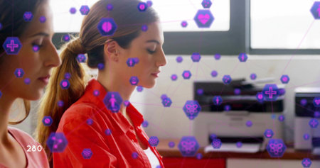 Sitting two women closing eyes near window, red-shirt pink-top, printer or copier purple-overlay...