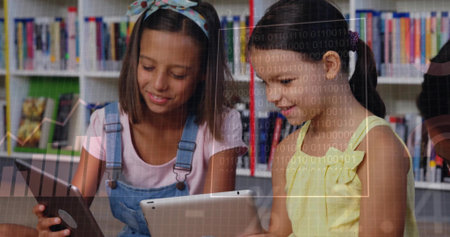 Reading two kids using tablets in library with digital overlays and shelves, in overalls and dress....