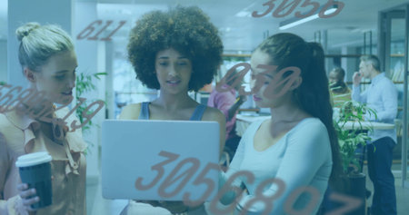 Leaning three women reviewing laptop in business-casual at open office, with red numerals on glass....