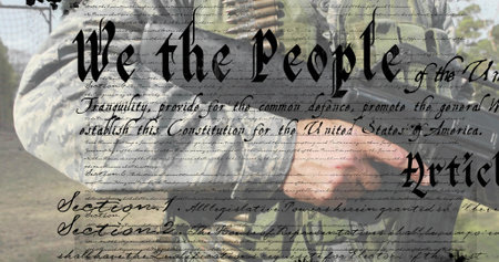 Holding assault rifle, soldier wearing camo vest at grassy field, with bandolier and founding text....