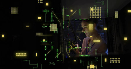 Connecting male tech checking patch cables in light shirt at rack with neon overlays, copy space....