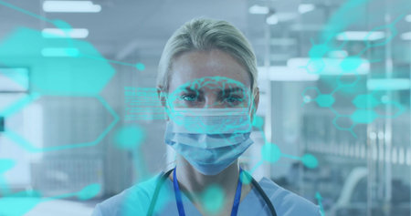 HUD highlighting clinician reviewing chart in clinic ward wearing scrubs, mask and stethoscope....