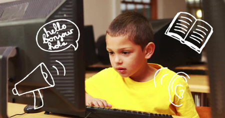 Working schoolboy wearing bright yellow T-shirt typing on keyboard in school lab, with doodle icons....