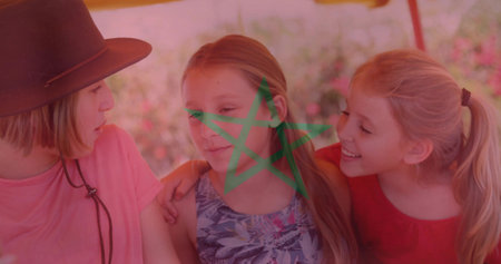 Sitting three girls hugging on bench under garden canopy, brown hat, green star on center face....