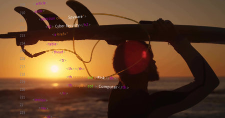 Carrying wetsuit surfer lifting longboard with fins and leash at sunset beach, with code overlay....