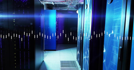 Showing data center aisle of server racks glowing under cool LED lighting, with vented floor panel....