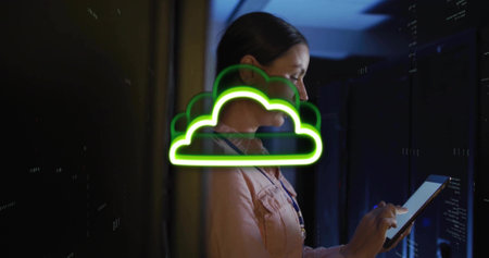 Using tablet female tech in button-up shirt with lanyard at server room, neon cloud, copy space....