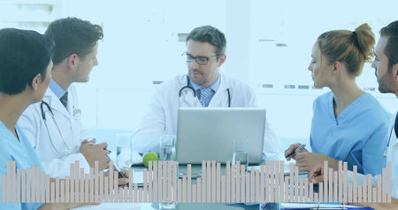 Leading lead doctor with stethoscope guiding medical team in meeting room, scrubs, waveform, laptop....