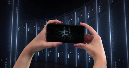 Holding hands and forearms framing smartphone at chest in curved racks, showing microchip and LEDs....