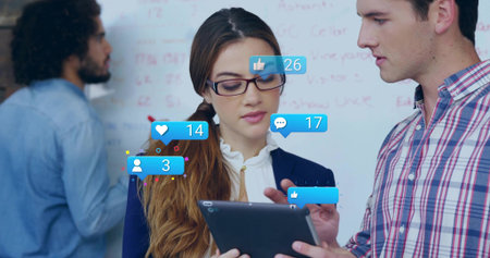Holding tablet, woman wearing glasses and blouse leading meeting in office with whiteboard, likes....