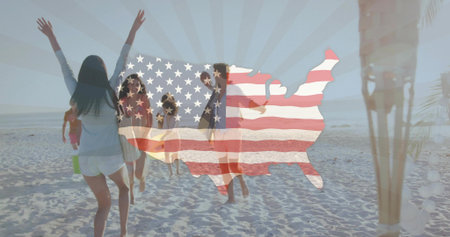 Running eight adults wearing casual summer clothes heading toward shore, with US flag overlay. Beach, sand, silhouettes, backlit, horizon, ocean, footprintsの写真素材