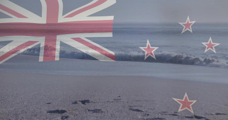 Showing faint New Zealand flag overlay over shore, revealing wet sand, footprints and waves. Ensign, stock, branding, translucent, advertising, coastal, seascapeの写真素材