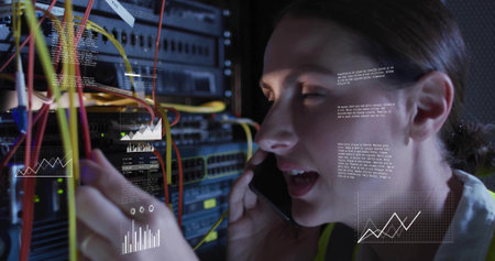 Plugging Ethernet cables into DC rack, tech holding phone, wearing hi-vis vest with HUD, copy space....
