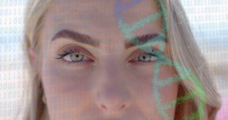 Gazing adult woman filling frame in studio, showing binary code and green map overlay. Face, portrait, closeup, eyes, eyebrow, blonde, digitalの写真素材