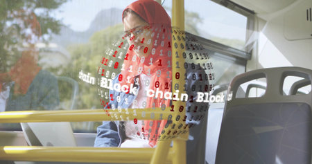 Typing woman wearing red hijab, denim jacket on bus with laptop near yellow rails, blockchain globe....