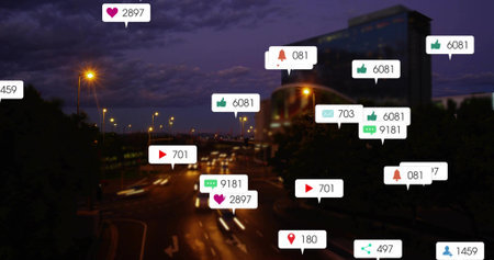 Floating cluster of social media icons hovering over city boulevard at night, with car light trails....