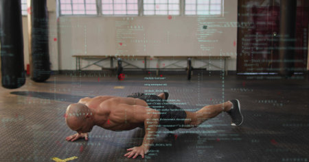 Performing shirtless man pushing body up on rubber floor, wearing athletic shoes, with code overlay. Athlete, muscular, calisthenics, gym, industrial, digital, projectionの写真素材