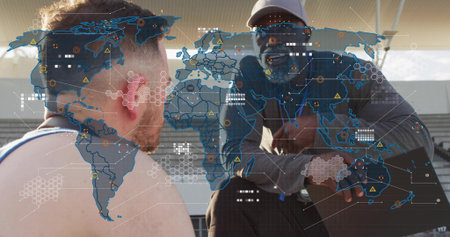 Advising coach in baseball cap and shades, athlete with bare torso listening on stands, map overlay....