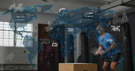 Jumping man in cap launching onto wooden box at gym with digital map overlay, copy space....