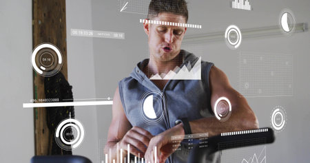 Checking mid-adult man wearing sleeveless hoodie, reading fitness band in gym, showing HUD and bike....