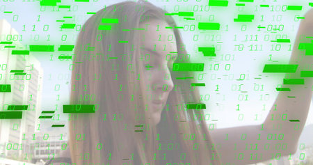 Raising arm, woman with brown hair taking selfie on rooftop wearing tank top, green binary overlay....