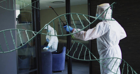 Spraying worker in coveralls at boardroom, using spray wand on glass with DNA helix, copy space....