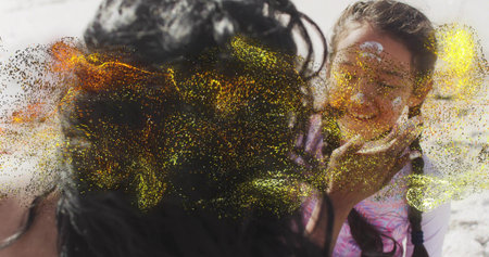 Touching woman cupping girl's chin on beach, braids, sunscreen spot, swim top, glitter, copy space....