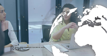 Talking woman in yellow top gesturing, speaking in conference room with laptop coffee map overlay. Business, meeting, collaboration, professionals, globe, documents, tableの写真素材