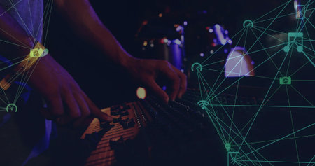 Adjusting tech hands mixing console on club stage, showing teal overlay and short-sleeve top. Sound,...