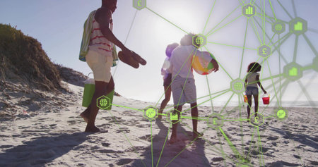 Walking family in swimwear carrying cooler, beach ball and red pail on beach, green network overlay....