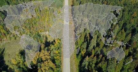 Vehicle driving rural road while world map overlay fading in with hex pattern enabling tech mapping. Aerial, drone, topdown, lane, forest, canopy, deciduous