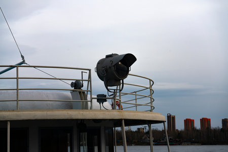 Lighting spotlights in front of the ship. Elements of river vessel equipment. Means to promote the safe navigation of water transport.の写真素材