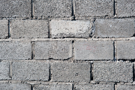 Background image of a stone wall. Texture of stones in close-up. Brick wall for background.