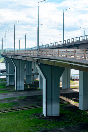 Automobile overpass road with fencing and lantern lighting. City road lighting.の写真素材