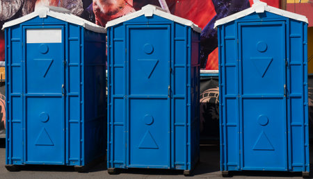 Blue booths of dry closets on a city street. Three blue toilet cubicles.の写真素材