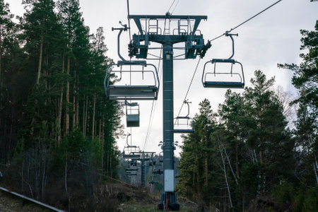 The support of the ski cable car on the top of the mountain. Cable car against the blue sky.の写真素材