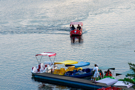 Catamaran rental on the river in the evening on a summer day. Russia, Krasnoyarsk June 2024. Outdoor...