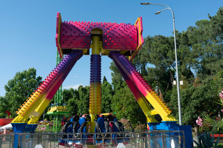 Bright colorful carousel in a summer amusement park. Childrens carousel in the park. Active recreation in the park in summer.の写真素材
