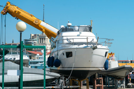 White boat in the parking lot of the resort town port. Boat in the parking lot of the sea port.の写真素材