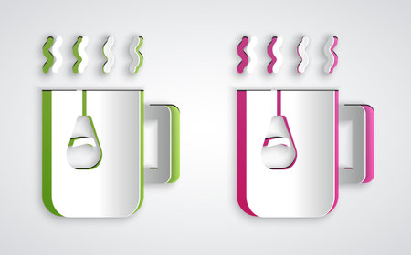 Paper cut Cup of tea with tea bag icon isolated on grey background. Paper art style. Vectorのイラスト素材