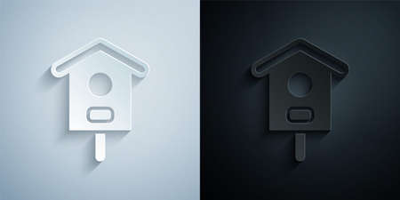 Paper cut Bird house icon isolated on grey and black background. Nesting box birdhouse, homemade building for birds. Paper art style. Vectorのイラスト素材