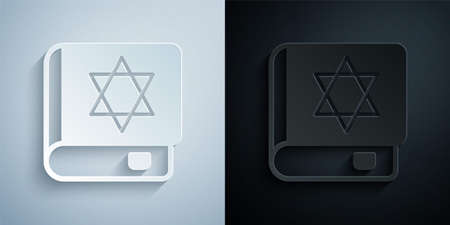 Paper cut Jewish torah book icon isolated on grey and black background. On the cover of the Bible is the image of the Star of David. Paper art style. Vectorのイラスト素材