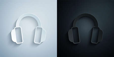 Paper cut Headphones icon isolated on grey and black background. Earphones. Concept for listening to music, service, communication and operator. Paper art style. Vectorのイラスト素材